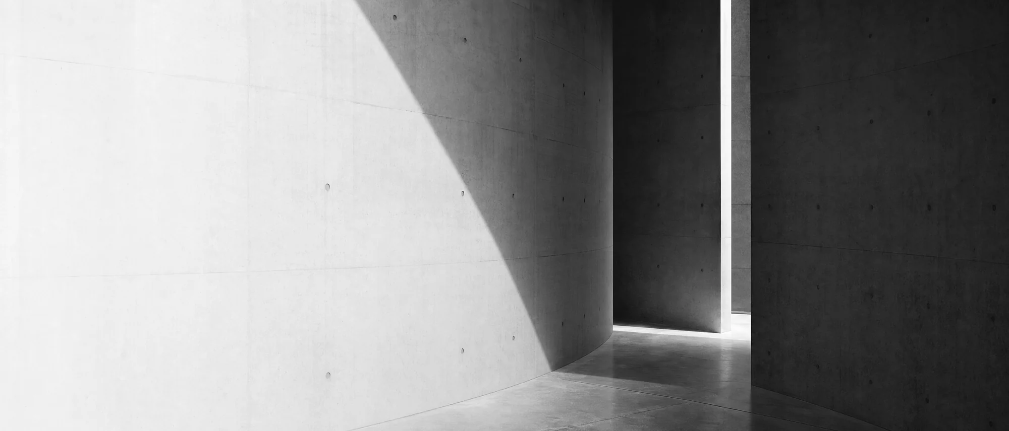 Architectural planes meeting in light and shadow